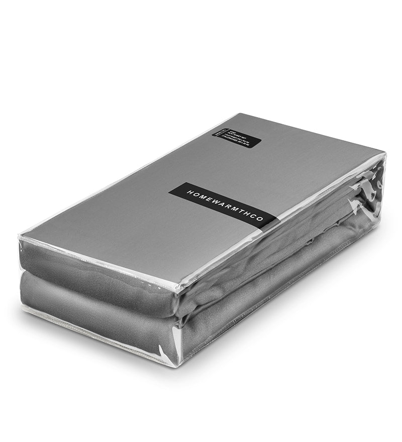 Silver mattress cover with 'HOMEWARMTHCO' label on a white background