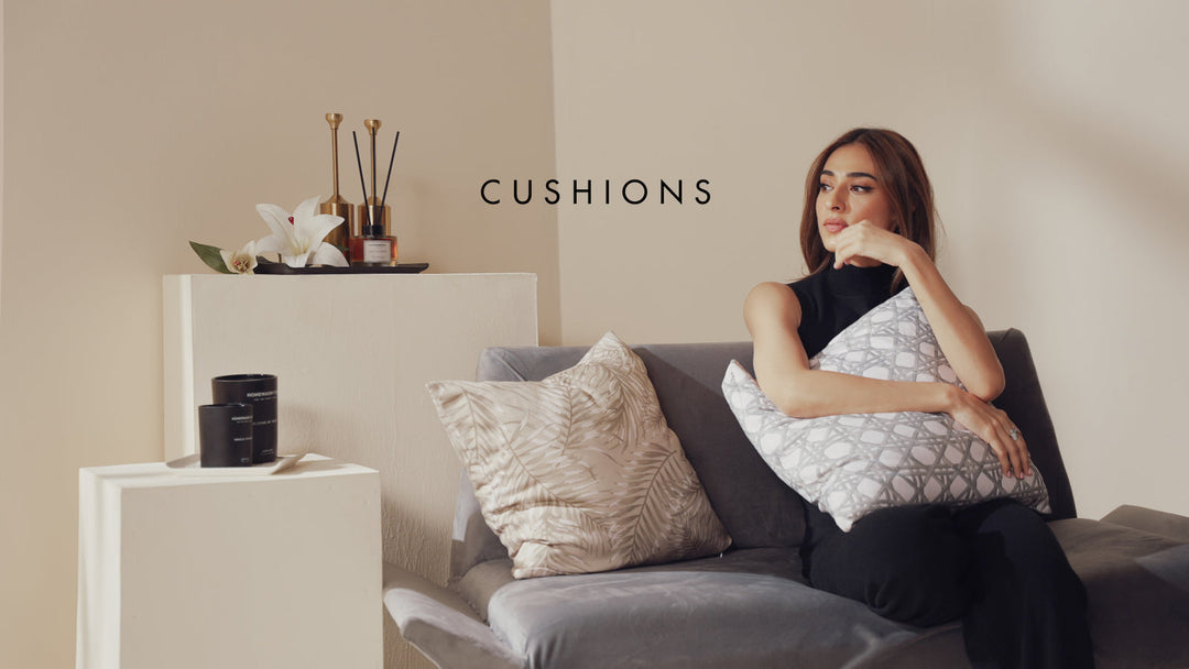 Cozy autumn bedroom with soft cotton bed linen, eco-friendly sheets, a fall room spray bottle on a wooden table, lit candle glowing warmly, scattered autumn leaves and pumpkins, soft natural lighting, calming aromatherapy vibe, high-quality lifestyle