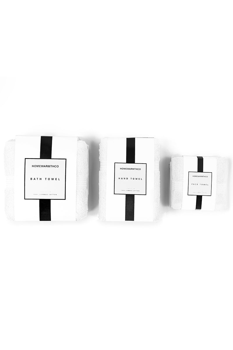 Two white bath towels with black stripes and labels on a white background