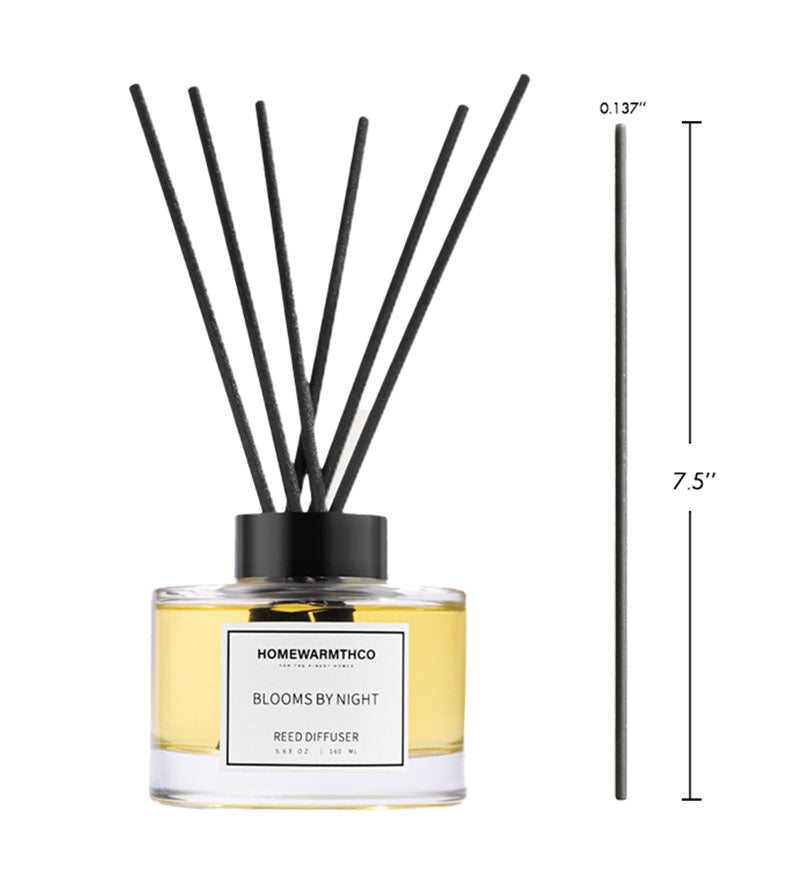 Reed diffuser labeled 'Homewarmthco Blooms by Night' with black sticks and measurements on a white background