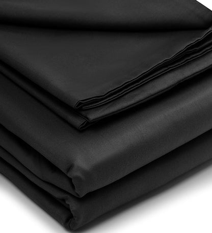 Stack of black folded fabric on a white background