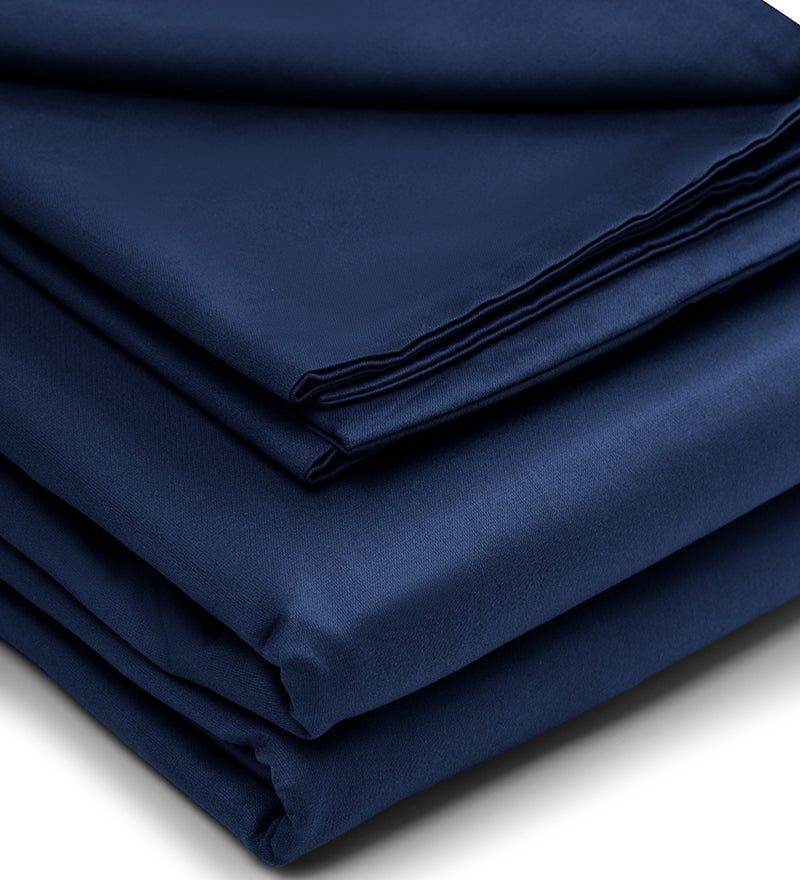 Folded navy blue fabric on a white background