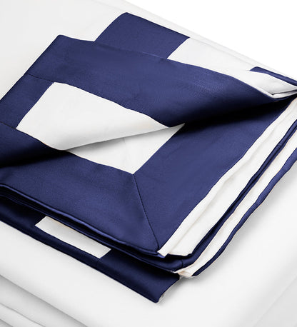 Navy and white striped fabric on a light gray background