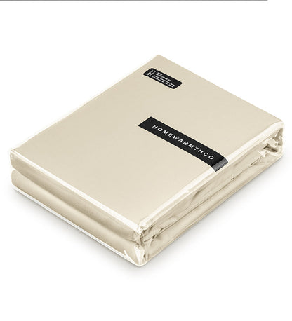 Folded beige blanket with 'Homewarmth' label on a white background