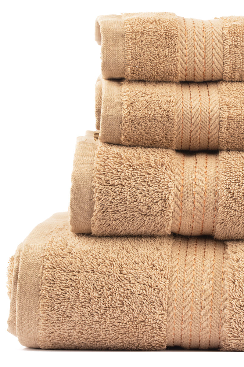 Stack of beige towels on a white background