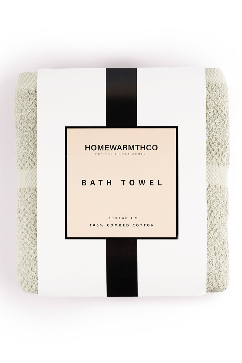 Bath towel with 'Homewarmthco' label on a white background