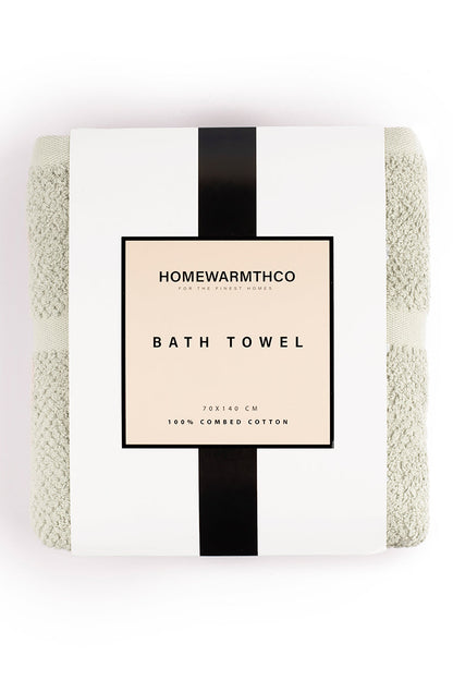 Bath towel with 'Homewarmthco' label on a white background