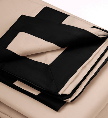 Black and beige fabric with a geometric pattern on a neutral background