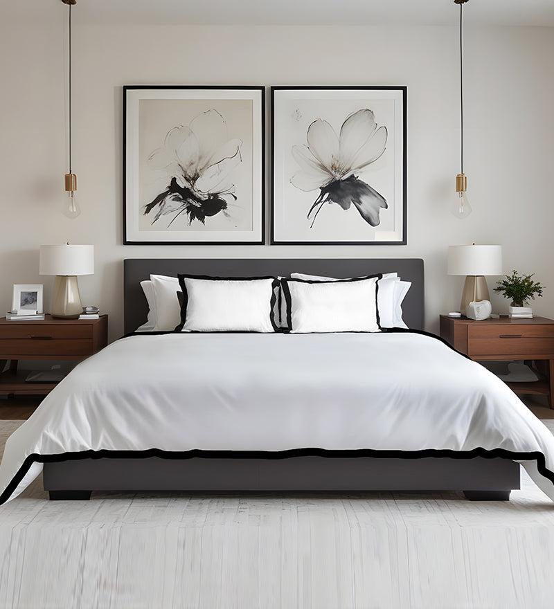Modern bedroom with a bed, nightstands, and abstract wall art.