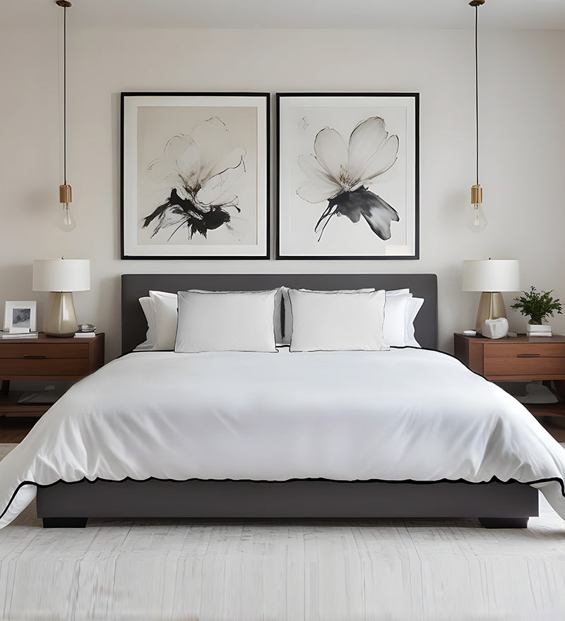 Modern bedroom with a bed, nightstands, and wall art.