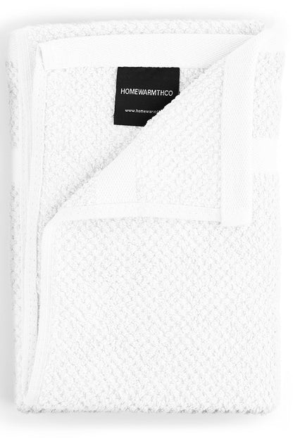 White textured blanket with a visible brand label on a white background