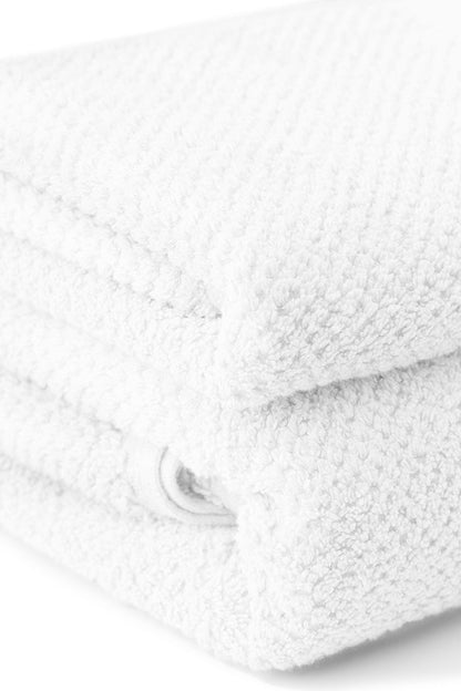 Close-up of a white textured fabric with a zipper