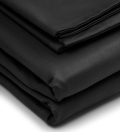 Folded black fabric on a white background