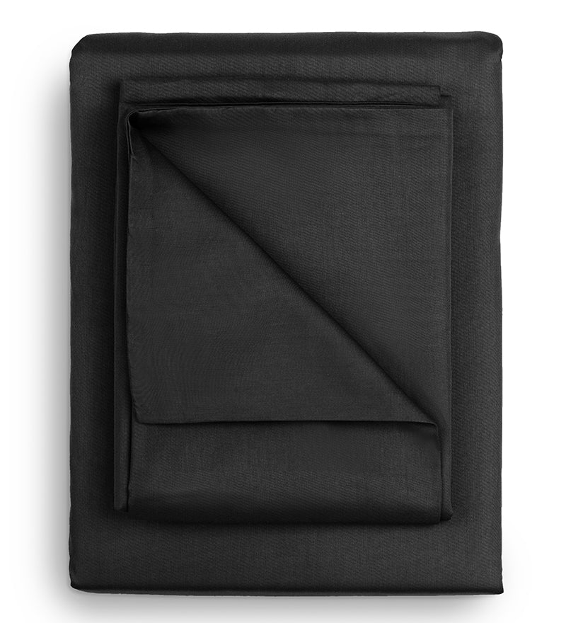 Folded black fabric on a white background