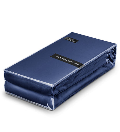Blue mattress cover with 'Home Warmth' label on a white background