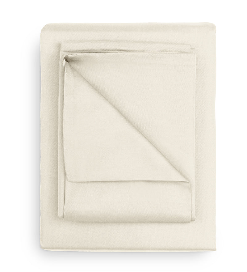 Folded beige fabric on a white background