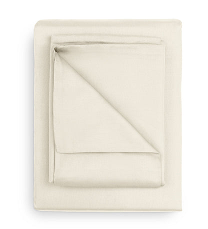 Folded beige fabric on a white background