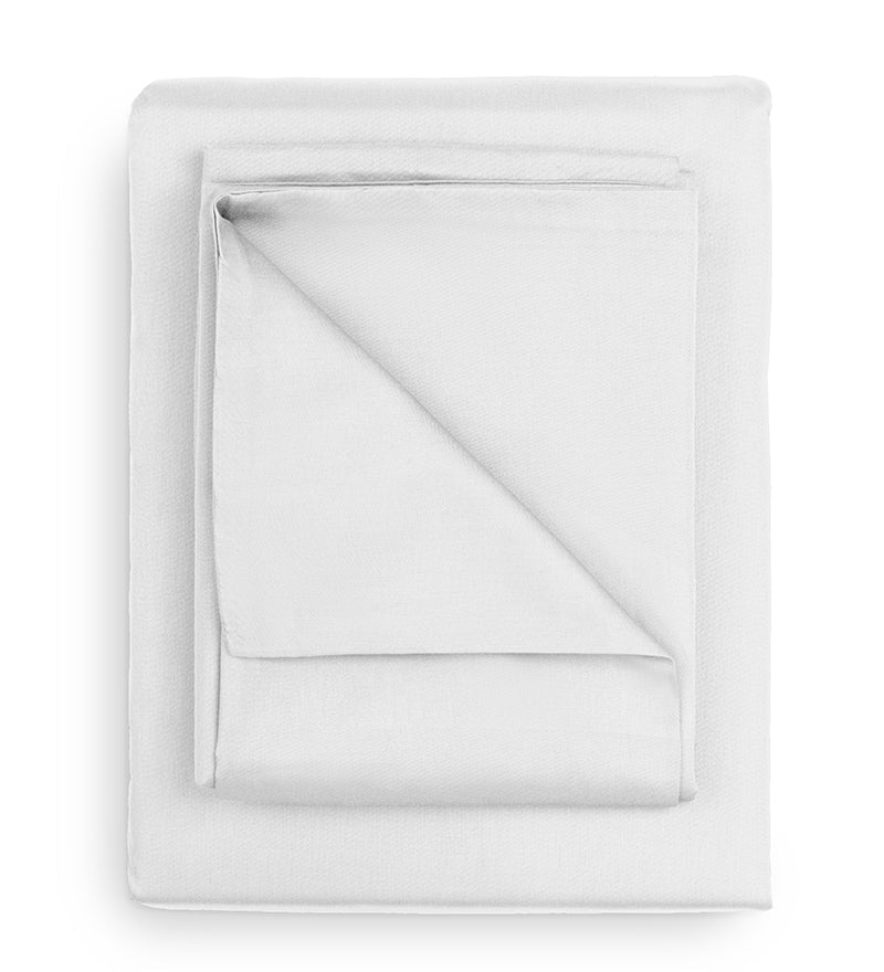 Folded white sheet on a white background