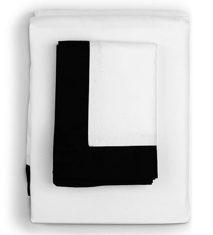 White blanket with a large black letter 'L' on a white background
