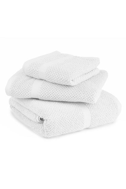Stack of textured white towels on a white background