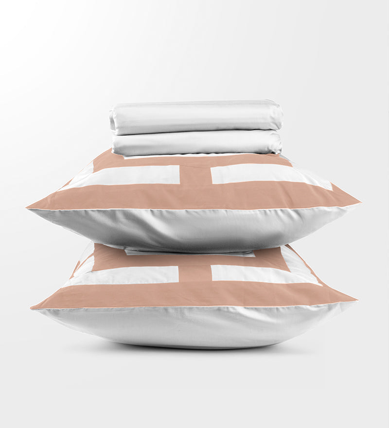 Stack of pillows with geometric patterns on a white background