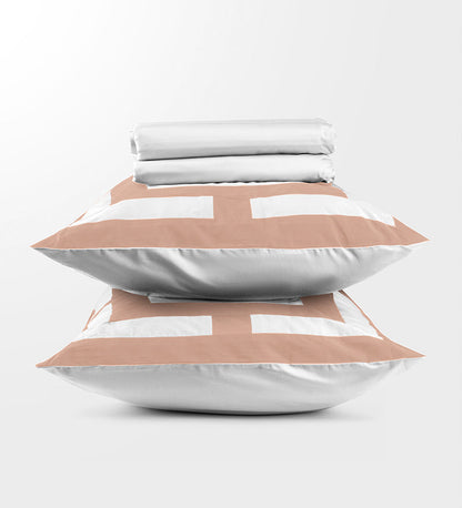 Stack of pillows with geometric patterns on a white background
