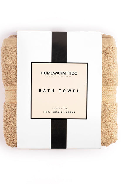 Beige bath towel with a label on a white background