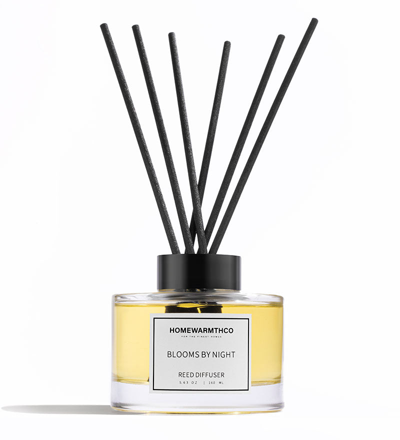 Reed diffuser labeled 'Homewarnthco Blooms by Night' on a white background