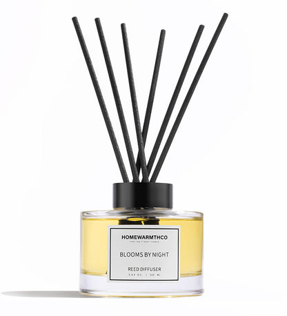 Reed diffuser labeled 'Homewarnthco Blooms by Night' on a white background
