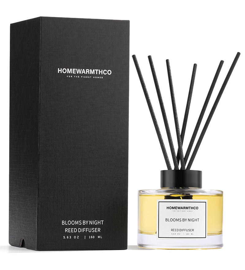 Homewarmthco reed diffuser with packaging on a white background