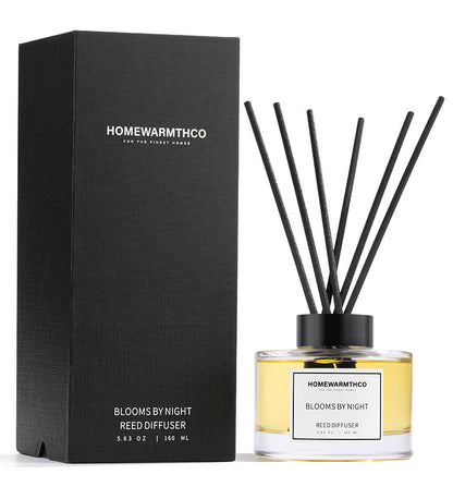 Homewarmthco reed diffuser with packaging on a white background