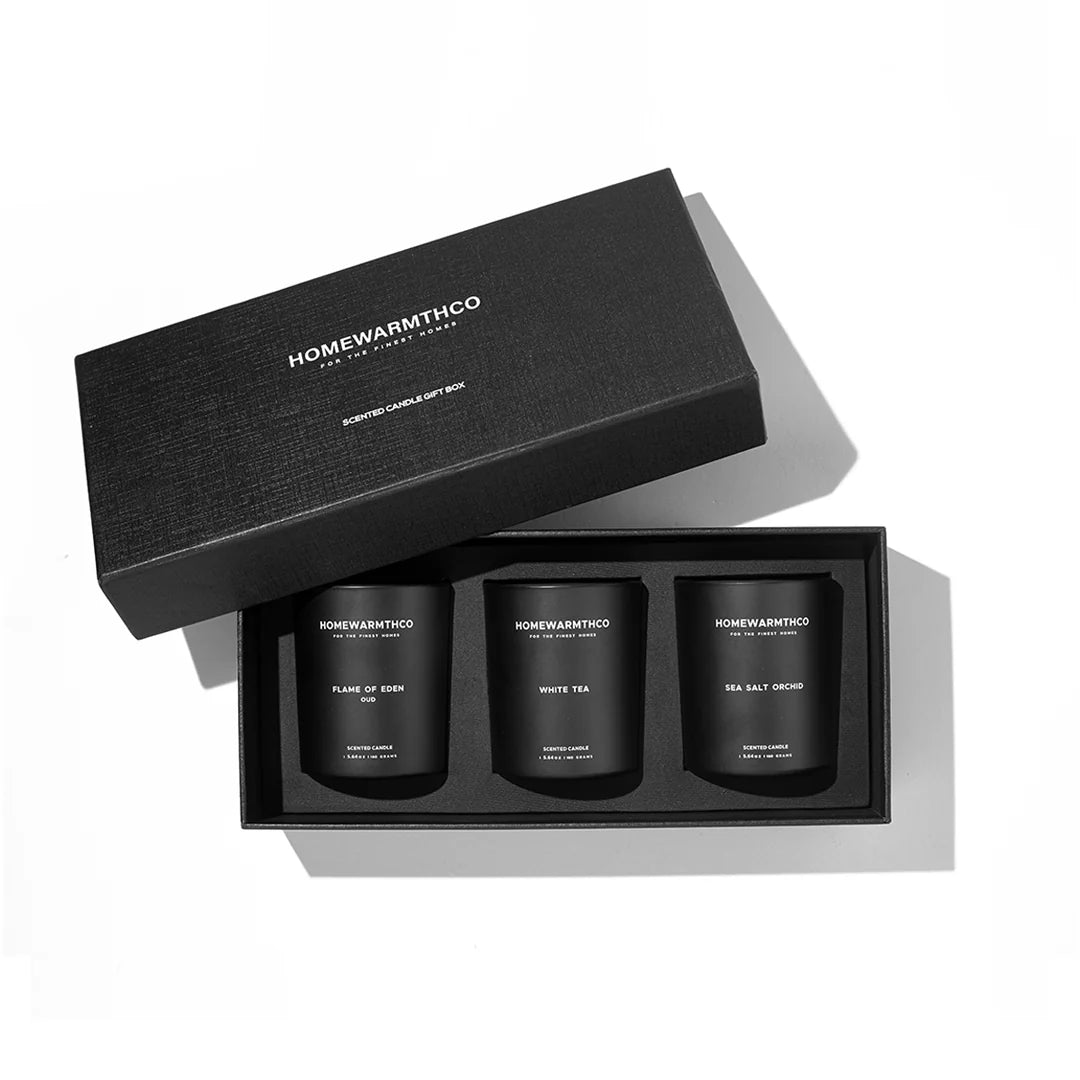 Homewarmthco candle gift set with three candles in a black box on a white background