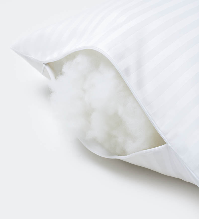 Close-up of a white pillow on a light gray background