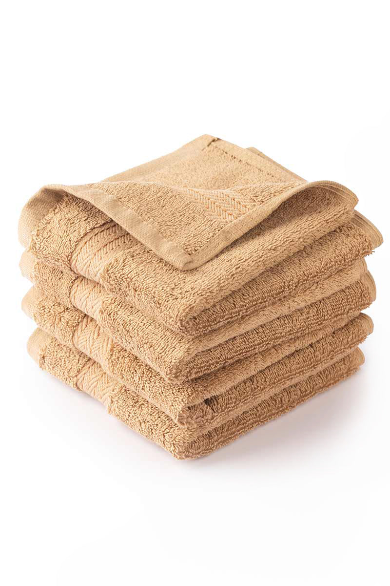 Stack of beige towels on a white background