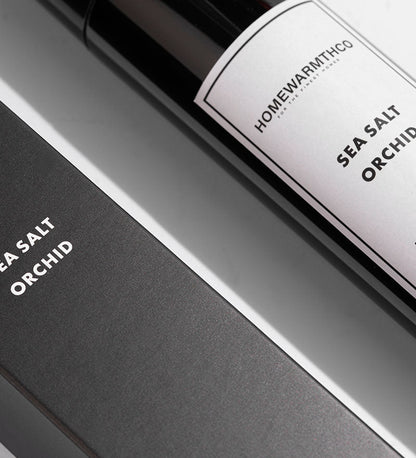 Close-up of a bottle labeled 'Sea Salt Orchid' by HomewarmthCo.