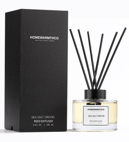 Homewarmthco Sea Salt Orchid reed diffuser with packaging on a white background