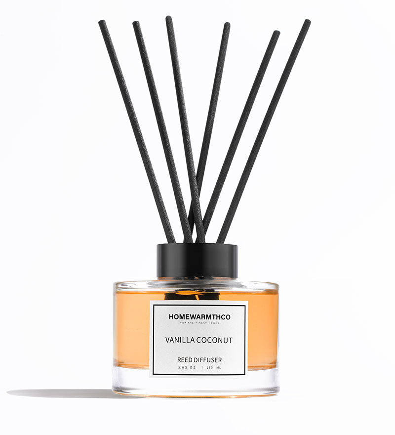 Homewarmthco Vanilla Coconut reed diffuser on a white background