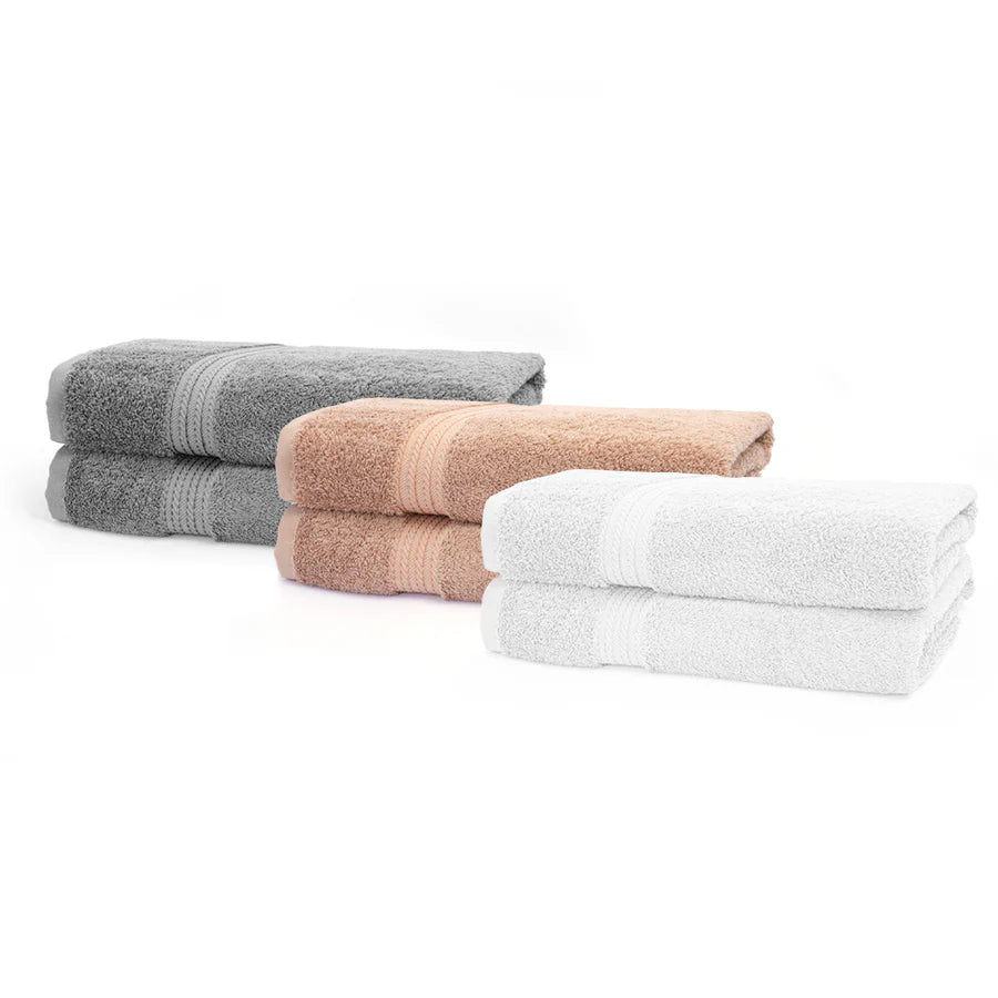 Three folded towels in gray, beige, and white on a white background