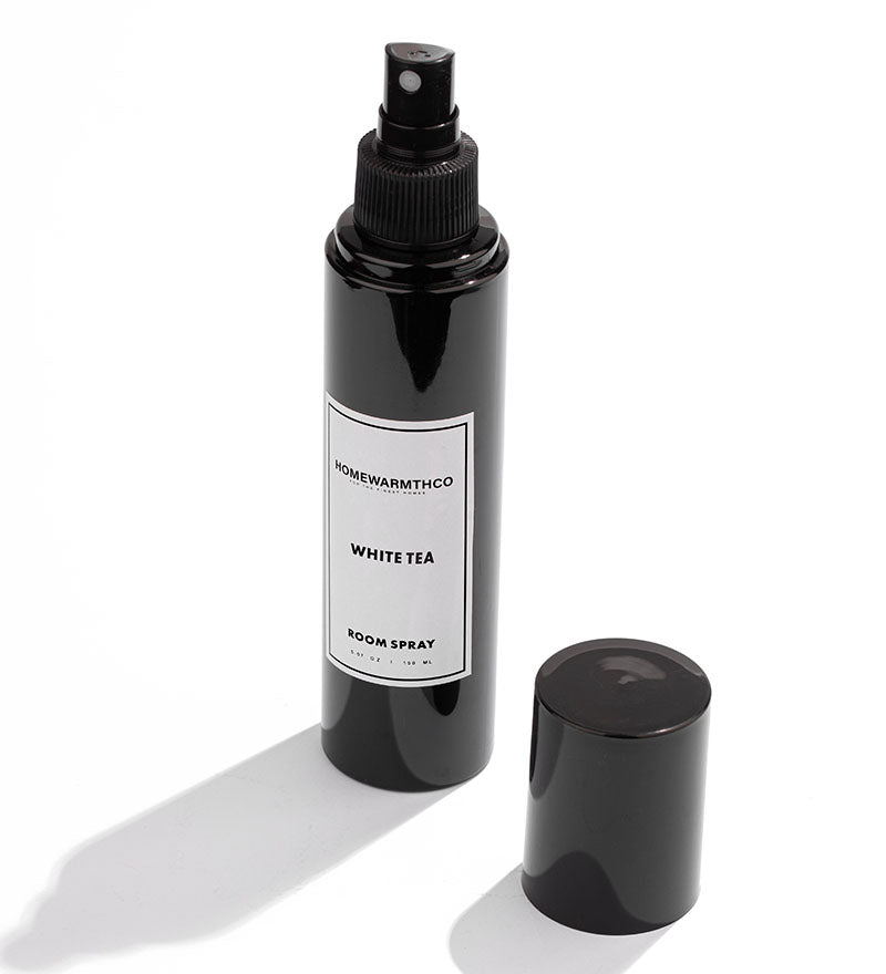 Whitetea Black room spray bottle with a label on a white background