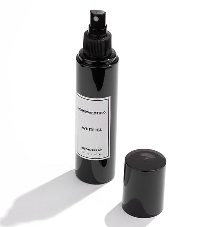 Whitetea Black room spray bottle with a label on a white background