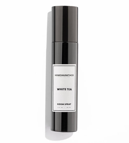 Room spray bottle labeled 'White Tea' by Homewarmthco on a white background