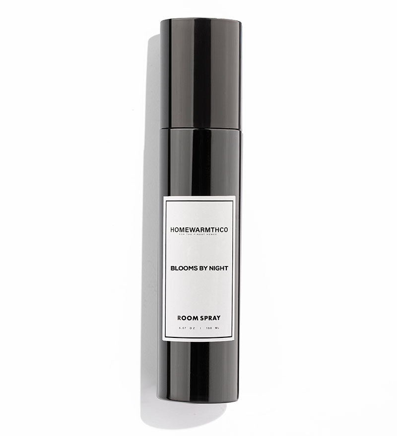Black room spray bottle with a white label on a white background