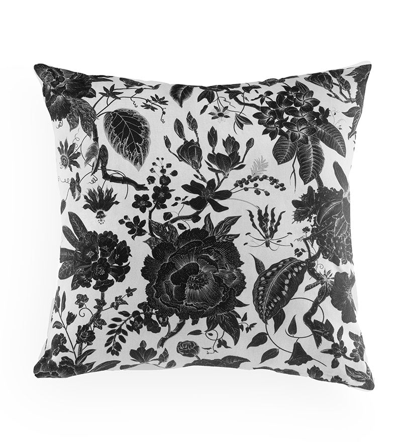 Decorative pillow with black floral pattern on a white background