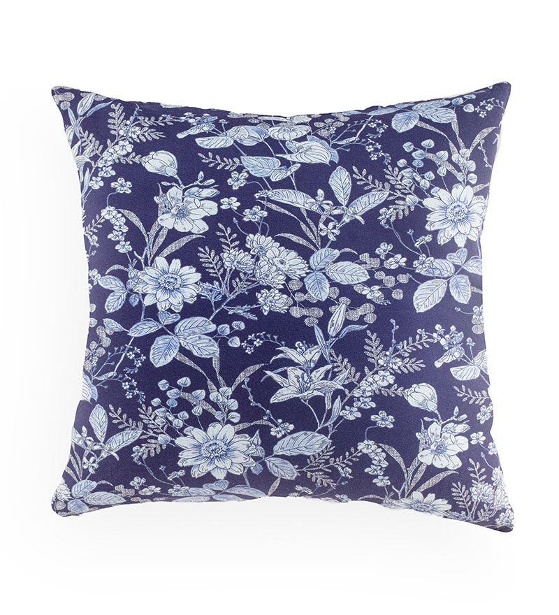 Floral patterned pillow with blue flowers on a white background