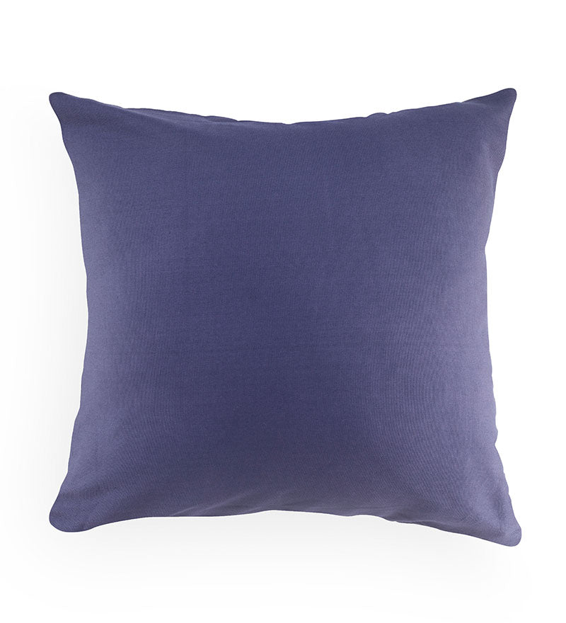 Solid purple pillow on a white background