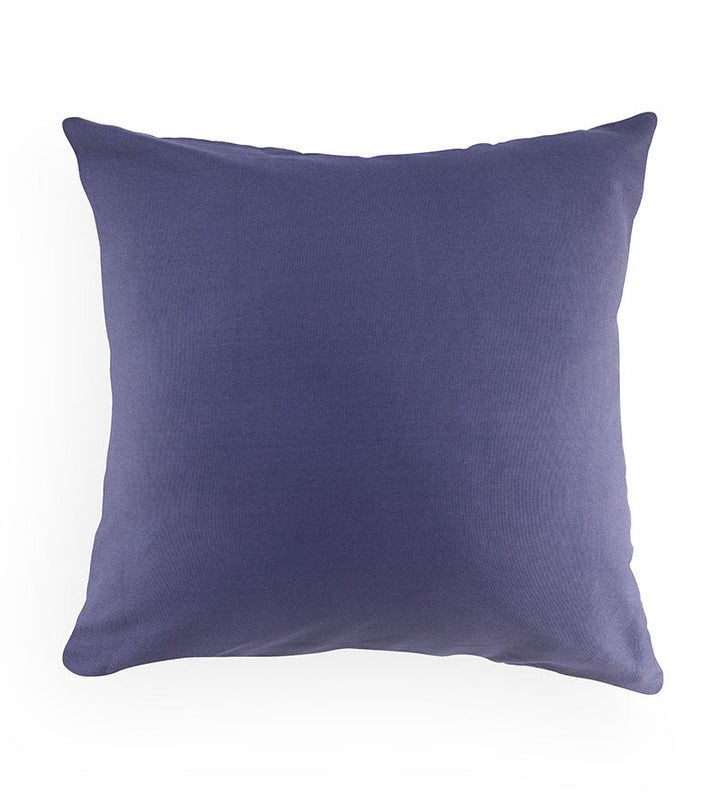 Solid purple pillow on a white background