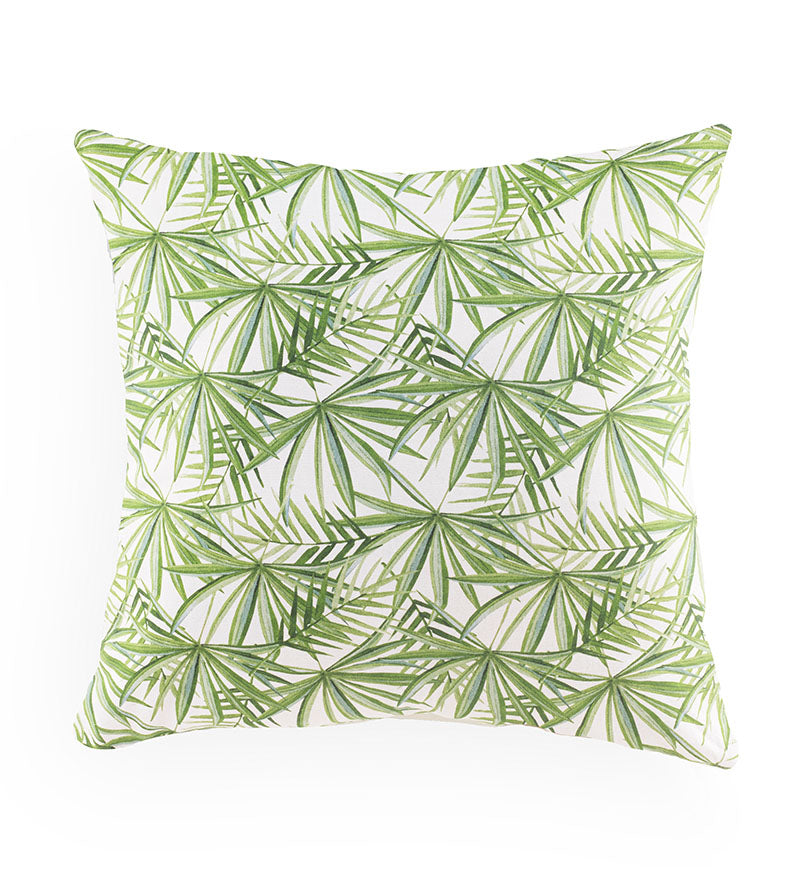 Green leaf patterned pillow on a white background