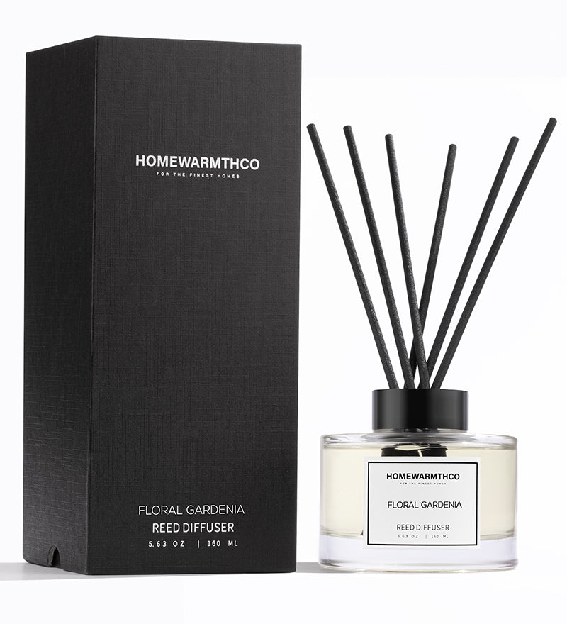 Homewarmthco floral gardenia reed diffuser with packaging on a white background