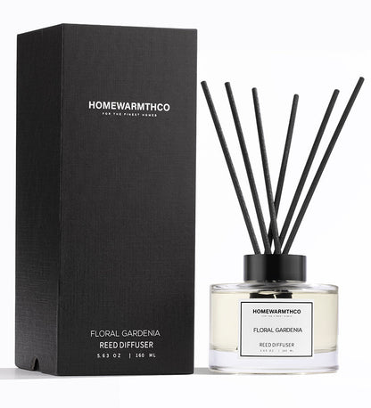 Homewarmthco floral gardenia reed diffuser with packaging on a white background