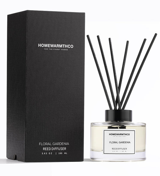 Homewarmthco floral gardenia reed diffuser with packaging on a white background